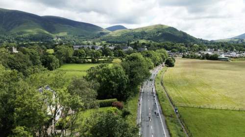 Flat lapped run course with mountain backdrop